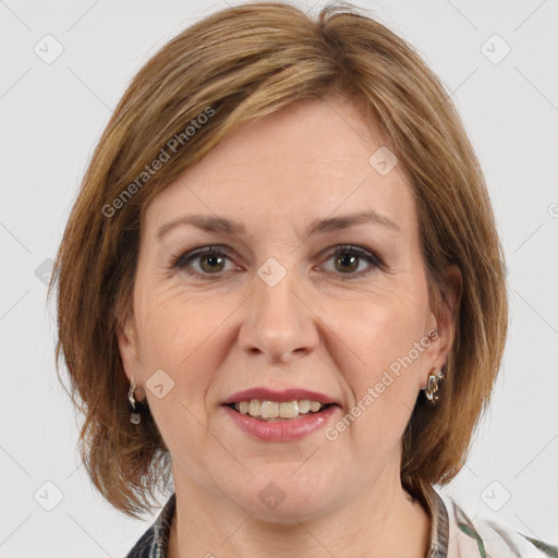 Joyful white adult female with medium  brown hair and brown eyes