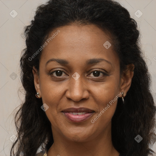 Joyful black adult female with long  brown hair and brown eyes