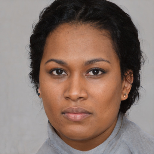 Neutral black young-adult female with short  black hair and brown eyes
