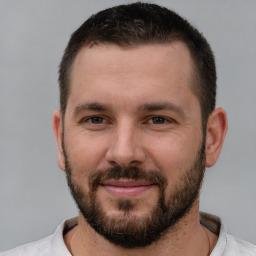 Joyful white young-adult male with short  brown hair and brown eyes