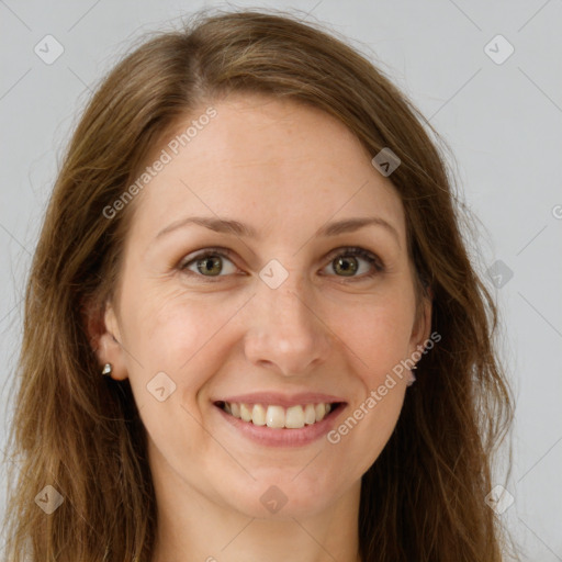 Joyful white young-adult female with long  brown hair and green eyes