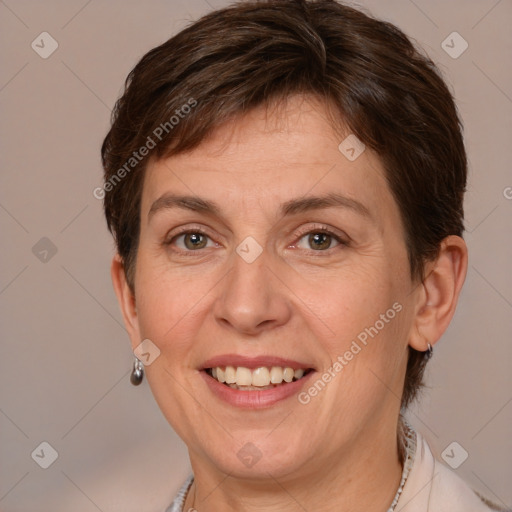 Joyful white adult female with medium  brown hair and brown eyes