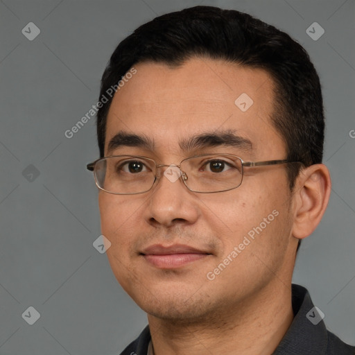 Joyful white adult male with short  black hair and brown eyes