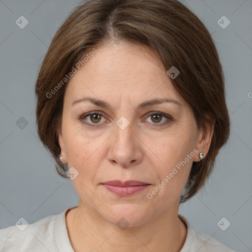 Joyful white adult female with medium  brown hair and brown eyes