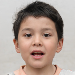 Joyful white child male with short  brown hair and brown eyes