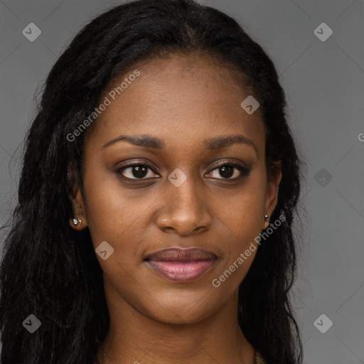 Joyful black young-adult female with long  brown hair and brown eyes