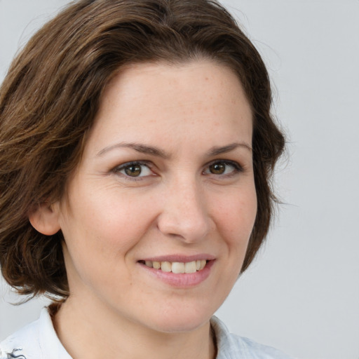 Joyful white young-adult female with medium  brown hair and brown eyes