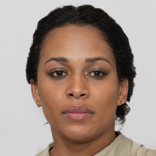 Neutral black adult female with short  brown hair and brown eyes