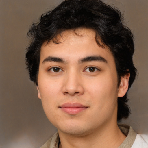 Joyful white young-adult male with medium  brown hair and brown eyes