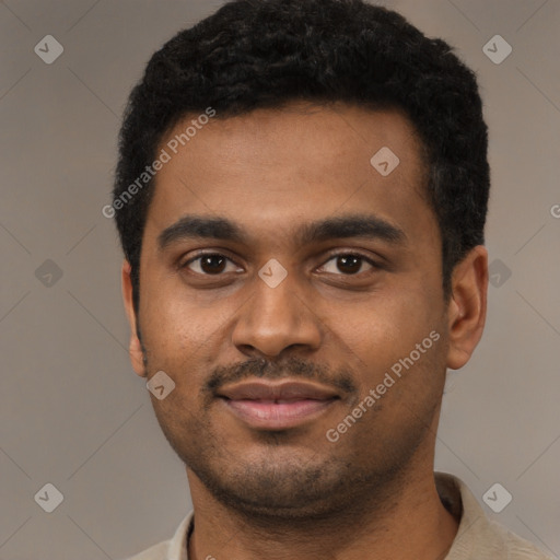 Joyful black young-adult male with short  black hair and brown eyes