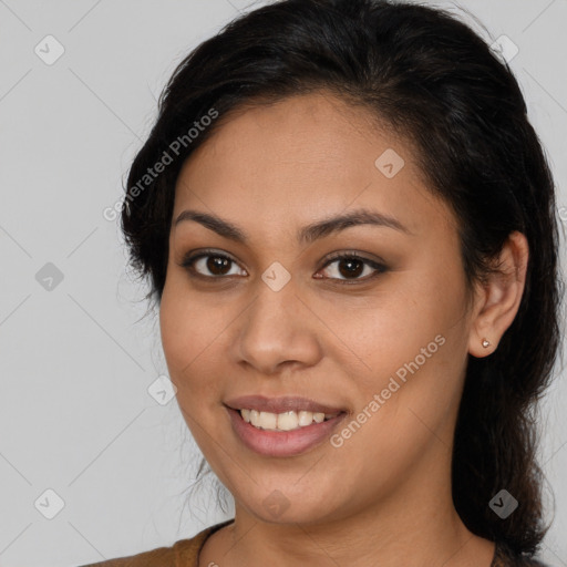 Joyful latino young-adult female with long  brown hair and brown eyes