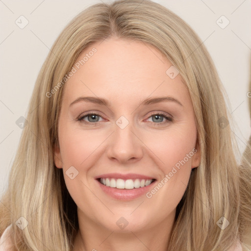 Joyful white young-adult female with long  brown hair and blue eyes