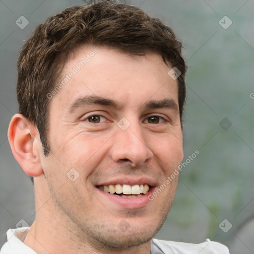 Joyful white adult male with short  brown hair and grey eyes