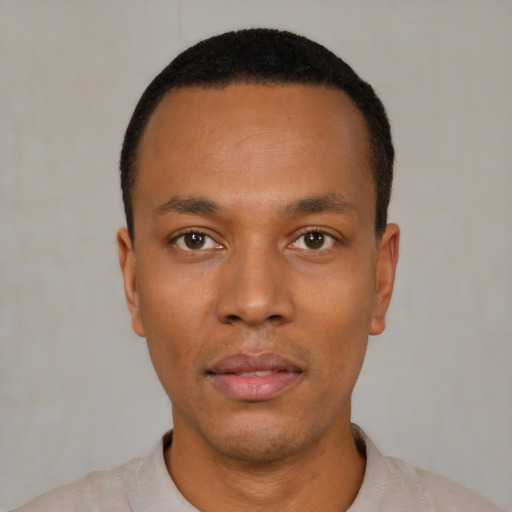 Neutral black young-adult male with short  black hair and brown eyes