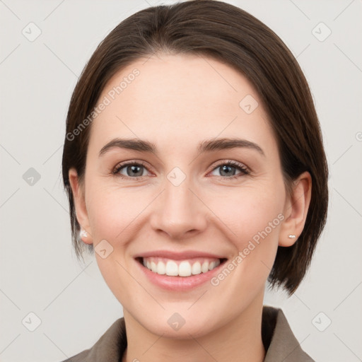 Joyful white young-adult female with medium  brown hair and grey eyes