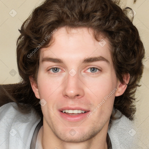 Joyful white young-adult male with medium  brown hair and brown eyes