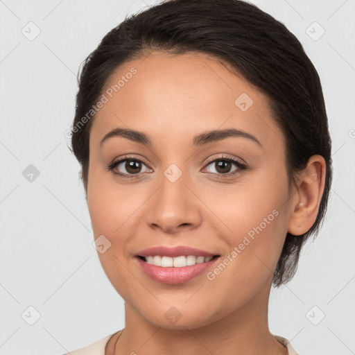 Joyful white young-adult female with long  brown hair and brown eyes