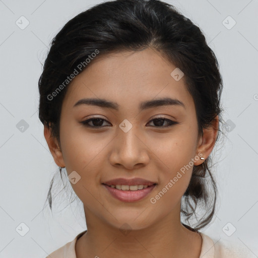 Joyful latino young-adult female with medium  brown hair and brown eyes