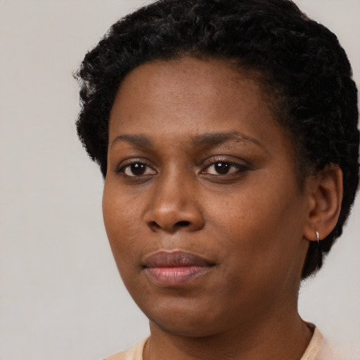 Neutral black young-adult female with short  black hair and brown eyes