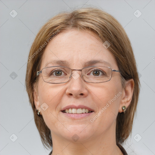 Joyful white adult female with medium  brown hair and blue eyes