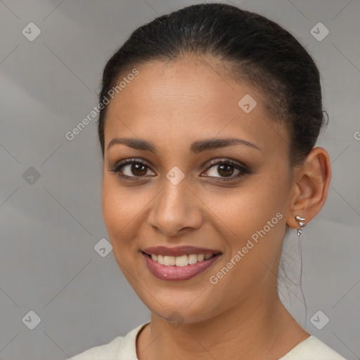 Joyful latino young-adult female with medium  brown hair and brown eyes