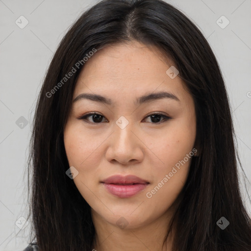 Joyful asian young-adult female with long  brown hair and brown eyes