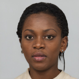 Neutral black young-adult female with short  black hair and brown eyes