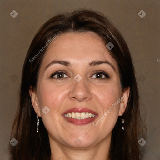 Joyful white adult female with long  brown hair and brown eyes