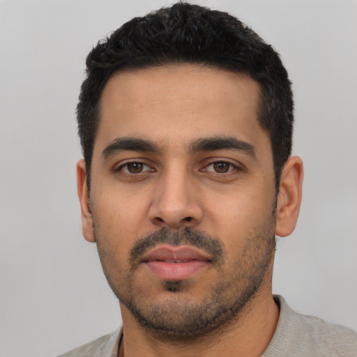 Neutral latino young-adult male with short  black hair and brown eyes