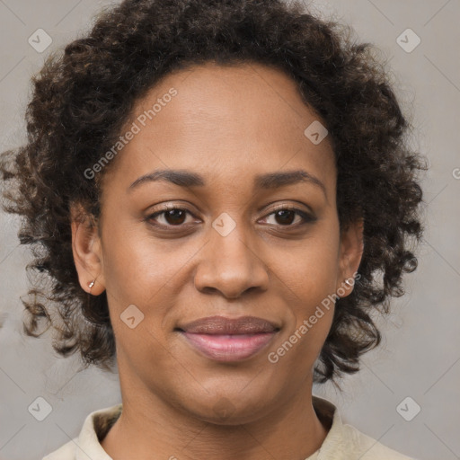 Joyful black young-adult female with medium  brown hair and brown eyes