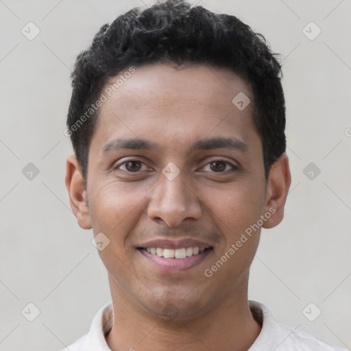 Joyful latino young-adult male with short  brown hair and brown eyes