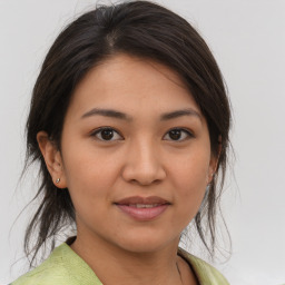 Joyful white young-adult female with medium  brown hair and brown eyes