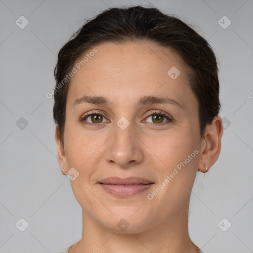 Joyful white young-adult female with short  brown hair and brown eyes