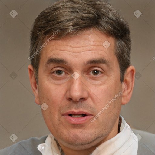 Joyful white middle-aged male with short  brown hair and brown eyes