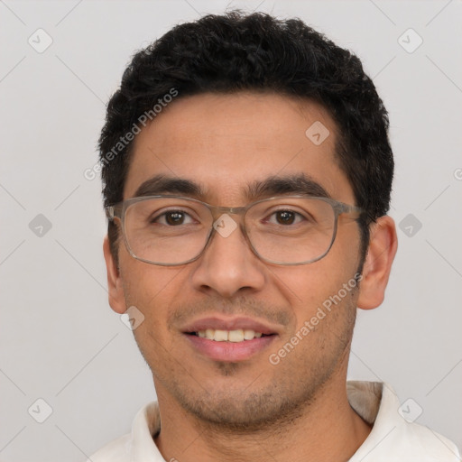 Joyful white young-adult male with short  black hair and brown eyes