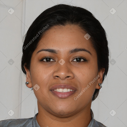 Joyful latino young-adult female with short  black hair and brown eyes