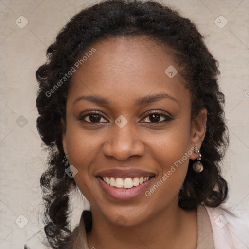 Joyful black young-adult female with long  brown hair and brown eyes