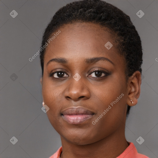 Joyful black young-adult female with short  black hair and brown eyes