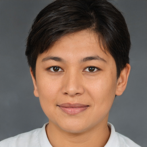 Joyful asian young-adult female with short  brown hair and brown eyes