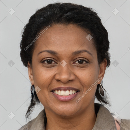 Joyful black adult female with short  brown hair and brown eyes