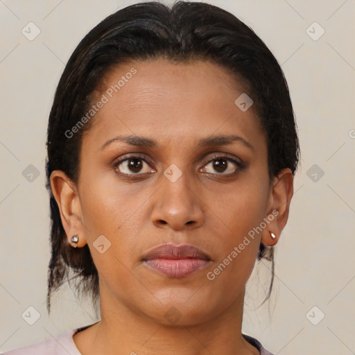 Joyful black young-adult female with medium  brown hair and brown eyes