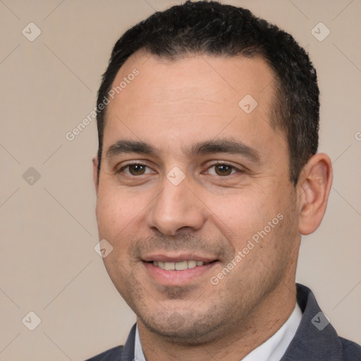 Joyful white young-adult male with short  black hair and brown eyes