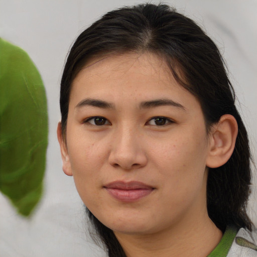 Joyful asian young-adult female with medium  brown hair and brown eyes