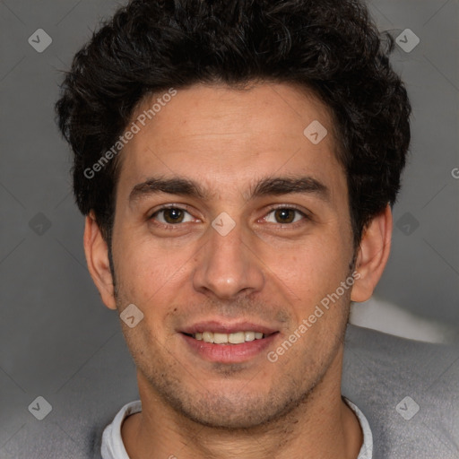 Joyful white young-adult male with short  black hair and brown eyes