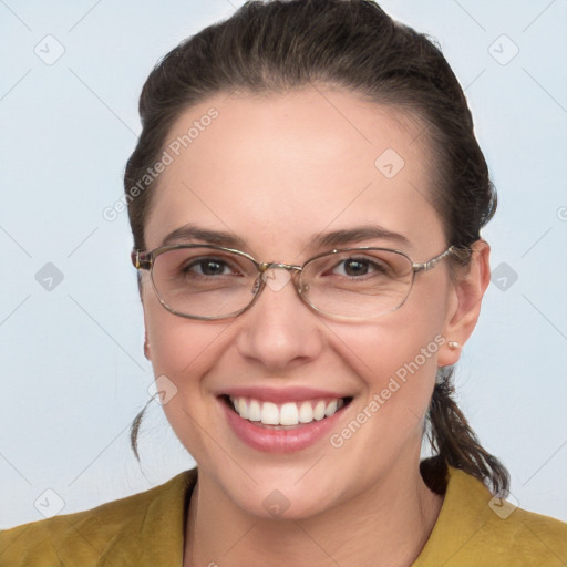 Joyful white adult female with medium  brown hair and grey eyes