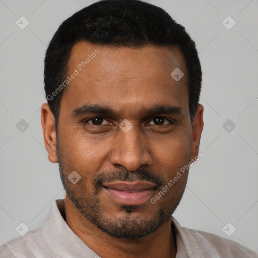 Joyful black young-adult male with short  black hair and brown eyes