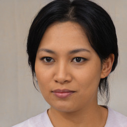 Neutral asian young-adult female with medium  black hair and brown eyes