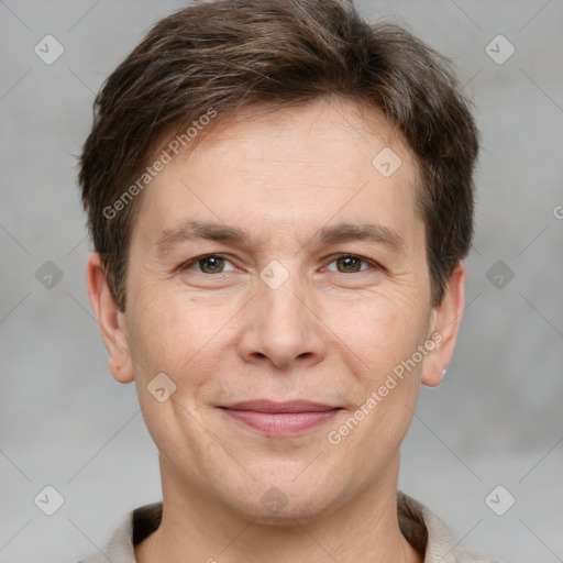 Joyful white adult male with short  brown hair and grey eyes