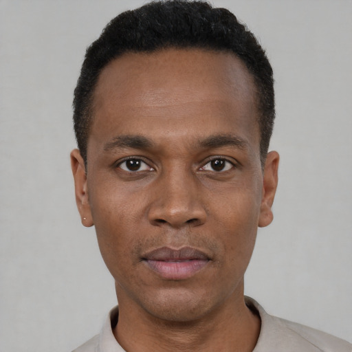 Neutral black young-adult male with short  black hair and brown eyes