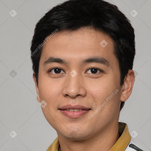 Joyful white young-adult male with short  black hair and brown eyes